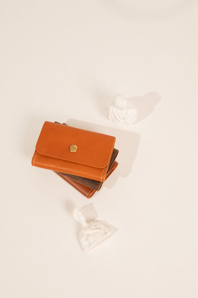 A stylish brown leather wallet displayed against a clean white backdrop.